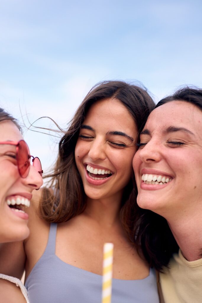 Portrait of group of young women laughing